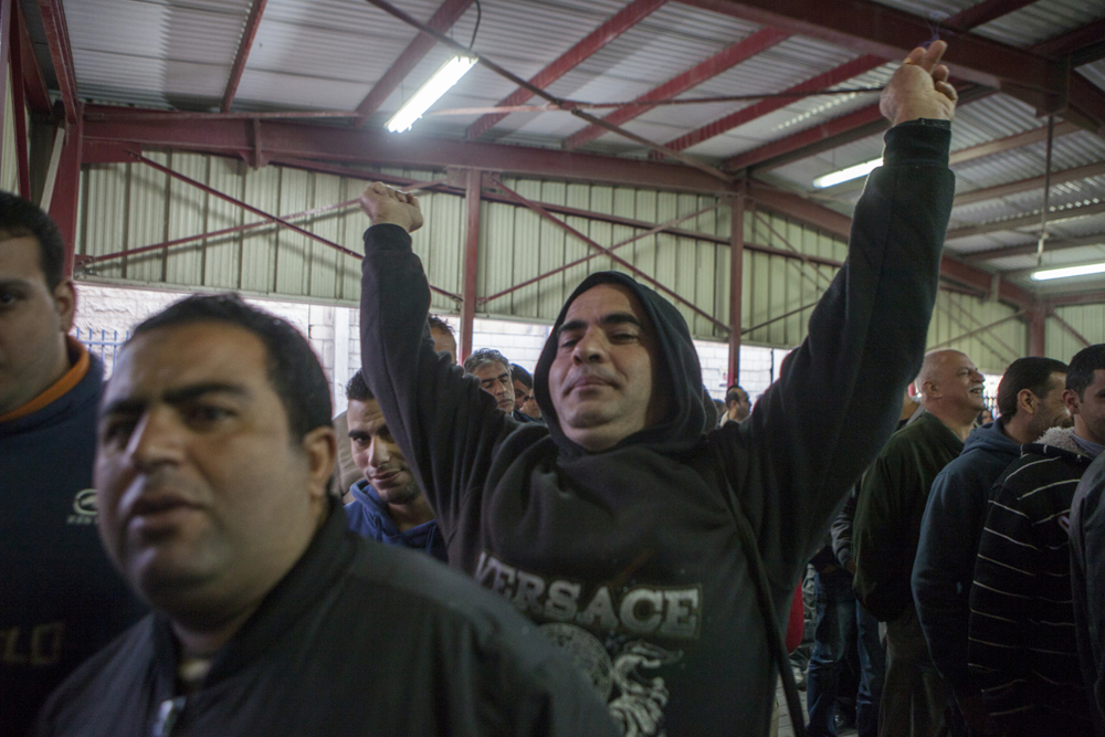 Palestinian workers at checkpoint 